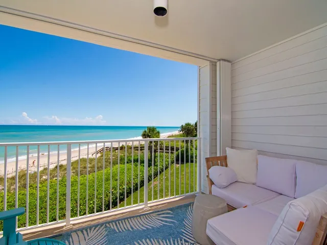 a view of balcony with furniture