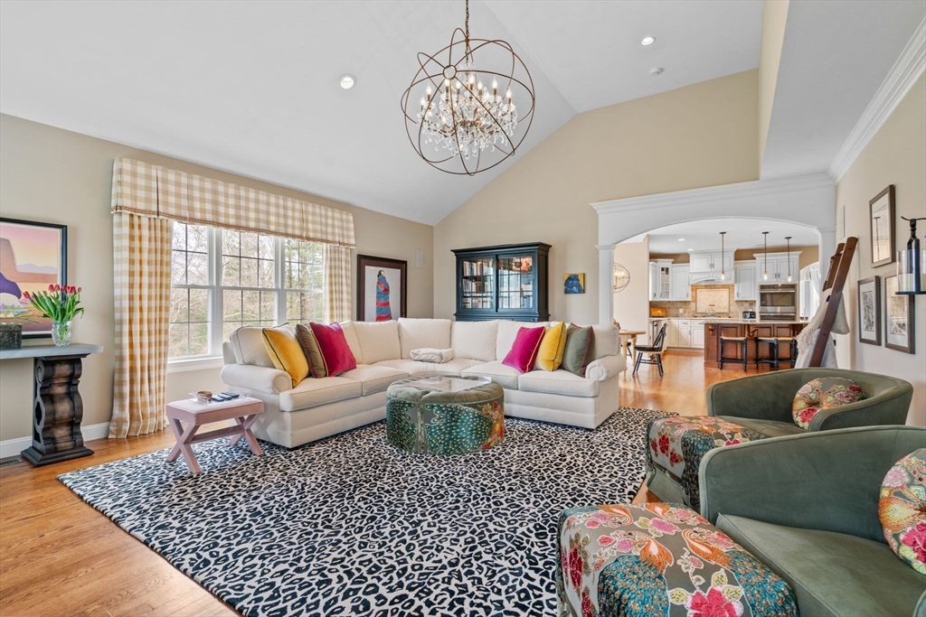 17 Applegate Road Medway, MA 02053 - Photo 16 of 42 a living room with furniture a rug and a chandelier