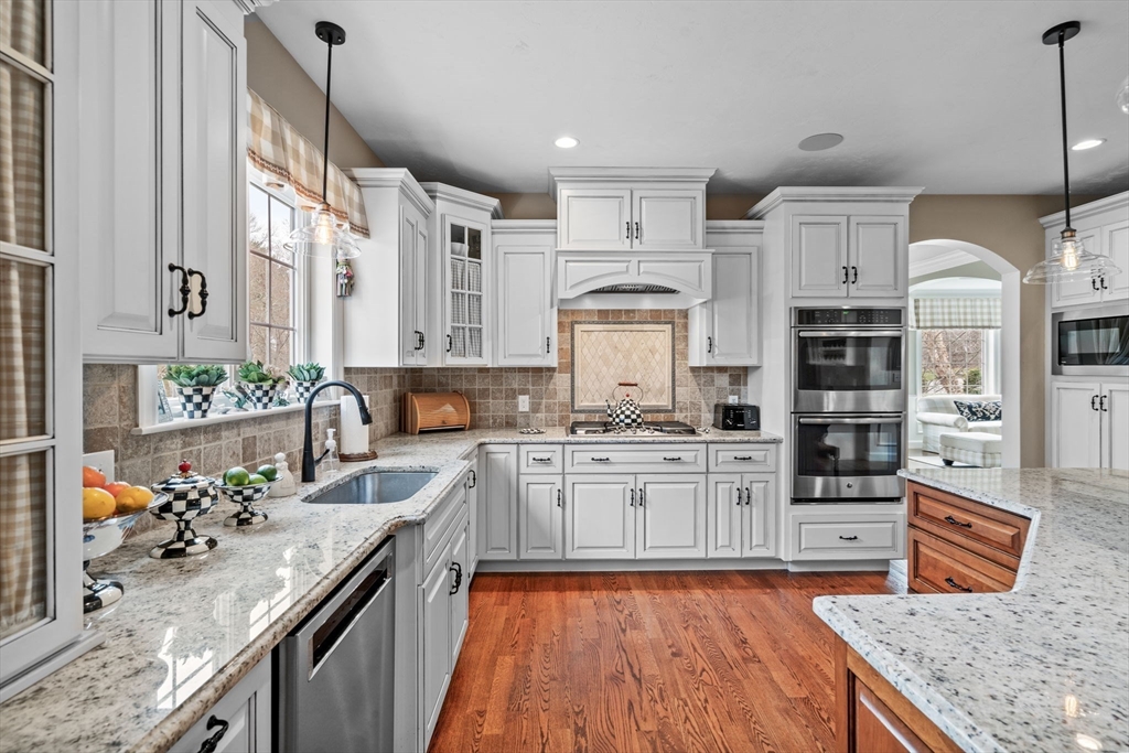 17 Applegate Road Medway, MA 02053 - Photo 9 of 42 a kitchen with stainless steel appliances granite countertop a stove oven and a refrigerator