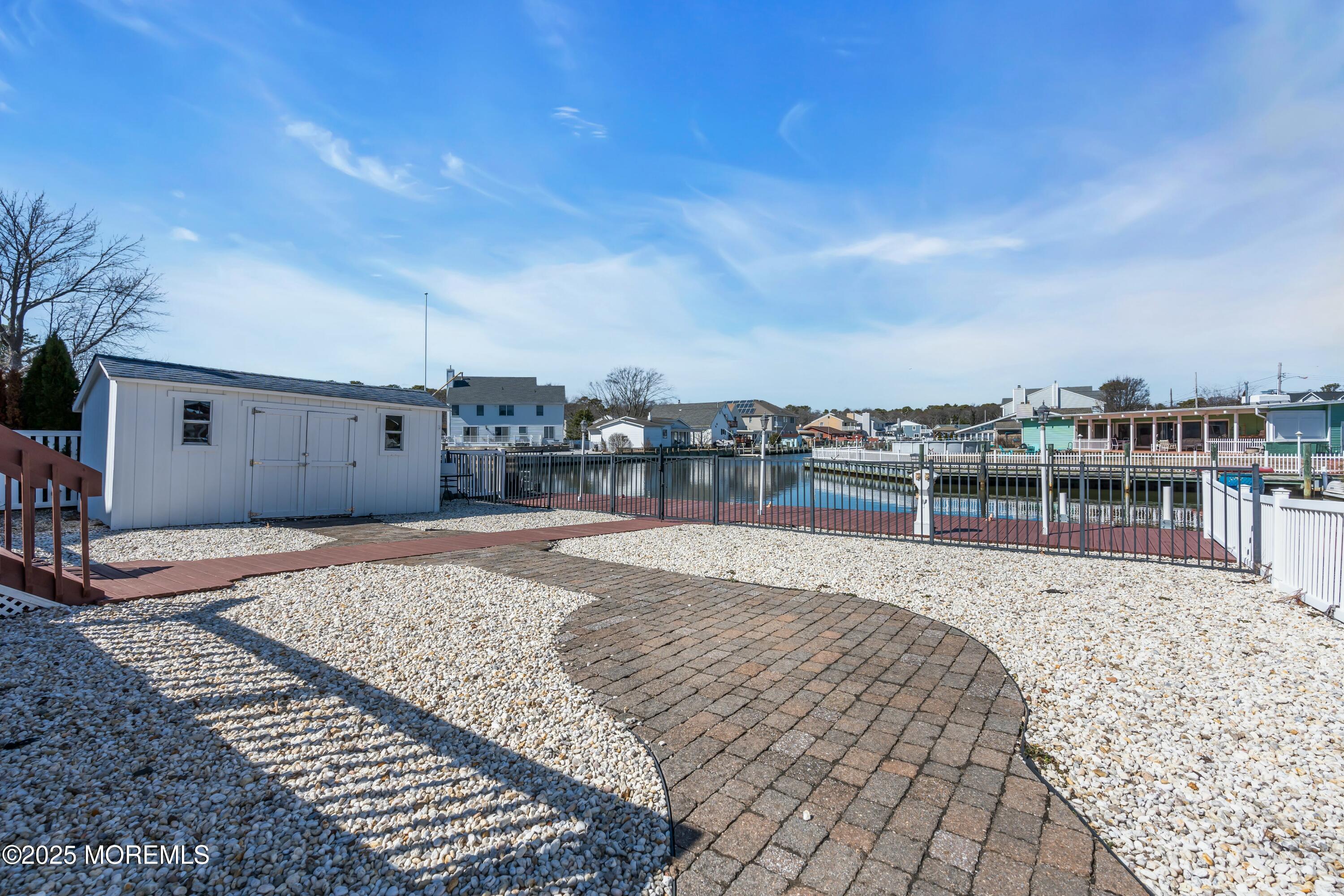 10 Commodore Drive Brick, NJ 08723 - Photo 16 of 27 a view of a swimming pool with a lounge chair