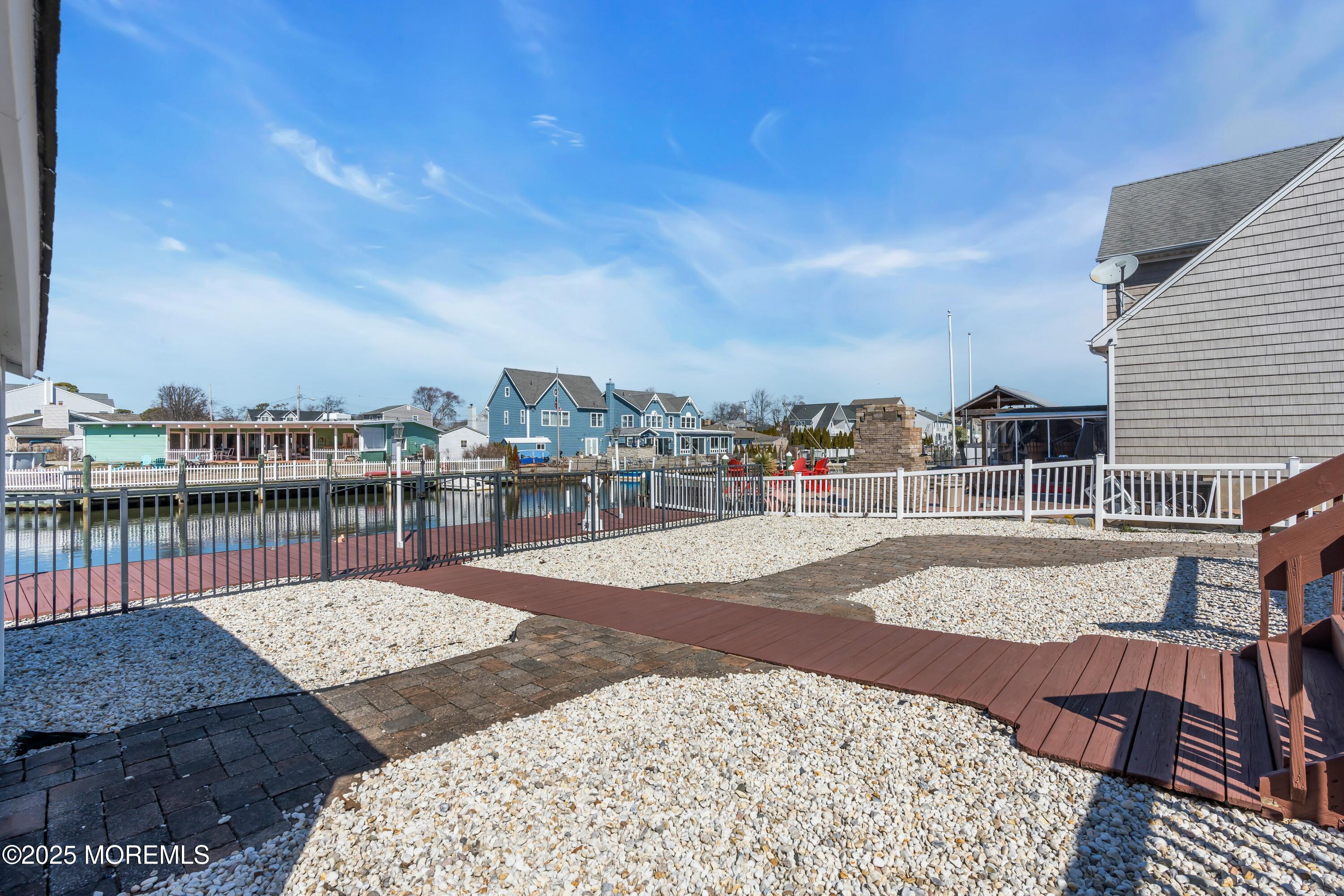 10 Commodore Drive Brick, NJ 08723 - Photo 18 of 27 a view of a swimming pool with seating area