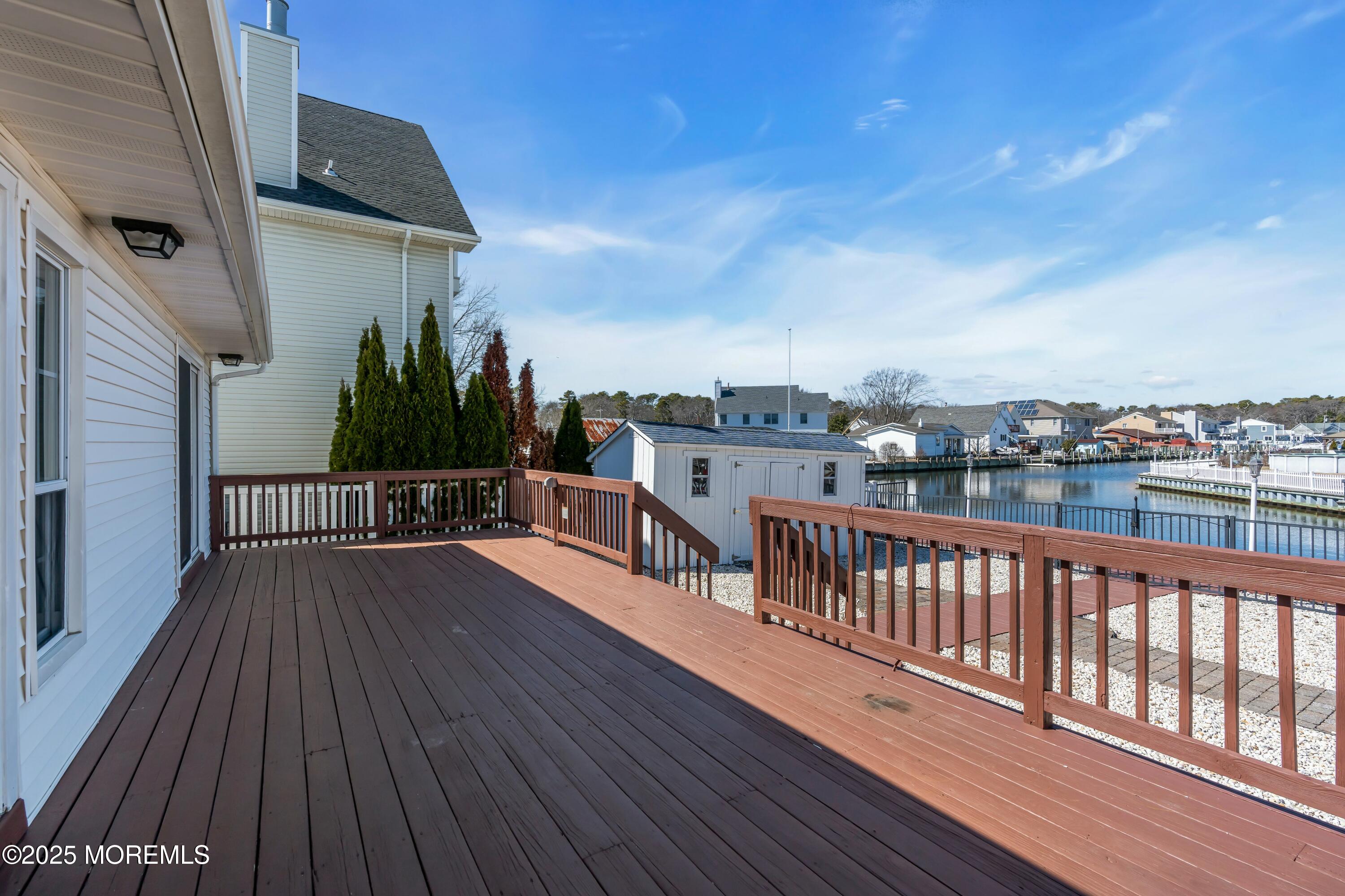10 Commodore Drive Brick, NJ 08723 - Photo 19 of 27 a view of balcony with wooden floor and fence
