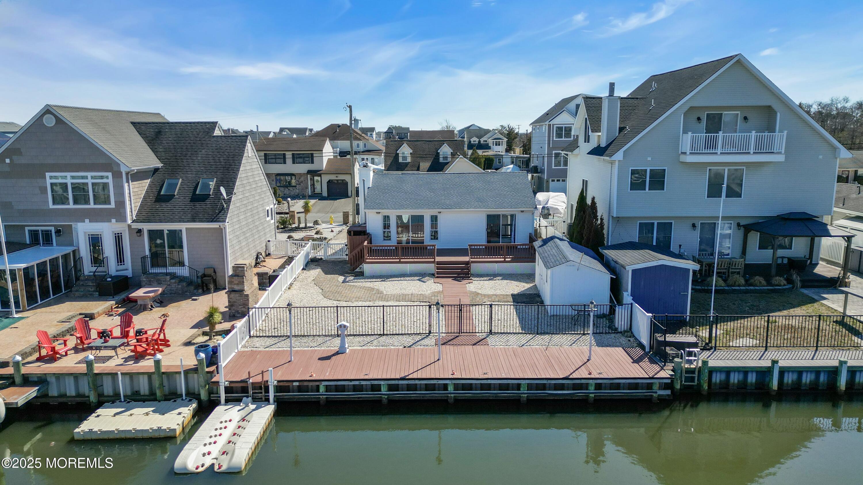 10 Commodore Drive Brick, NJ 08723 - Photo 21 of 27 a view of a lake with a house