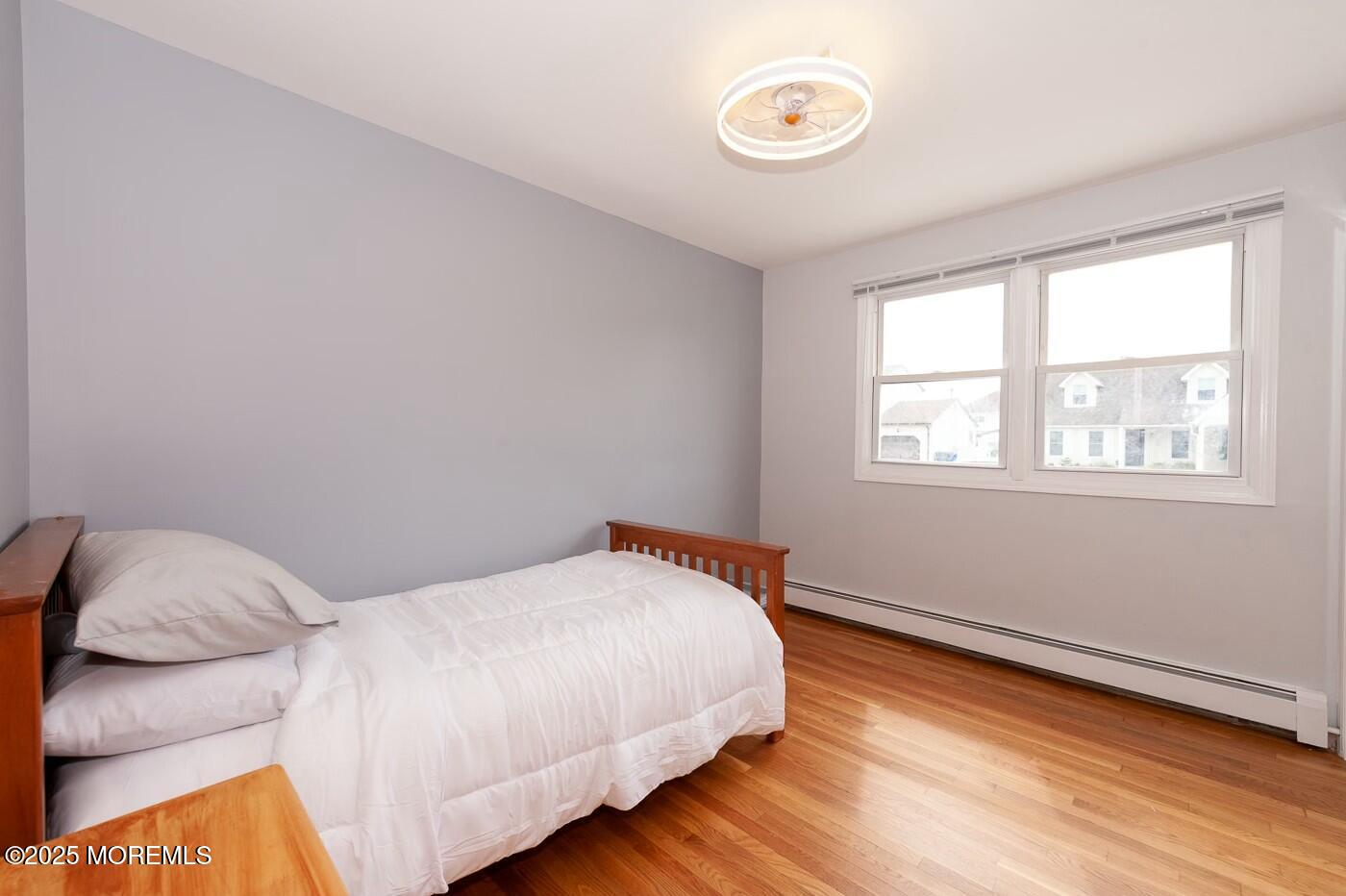 10 Commodore Drive Brick, NJ 08723 - Photo 24 of 27 a bedroom with a bed and a window