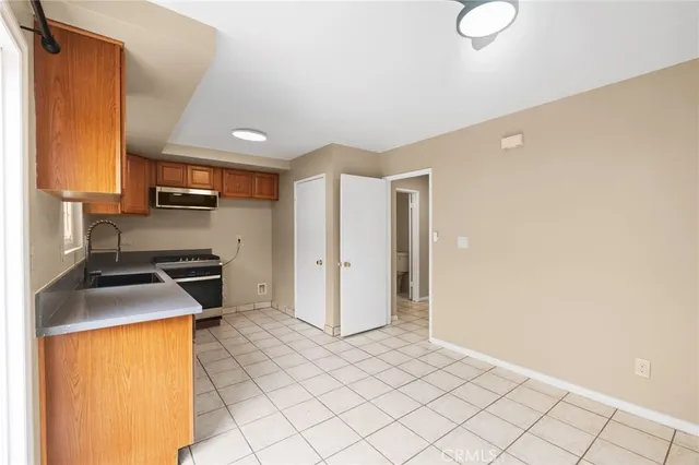 a kitchen that has a sink and a stove