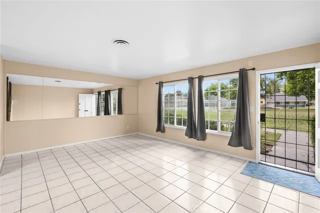 a view of an empty room and window