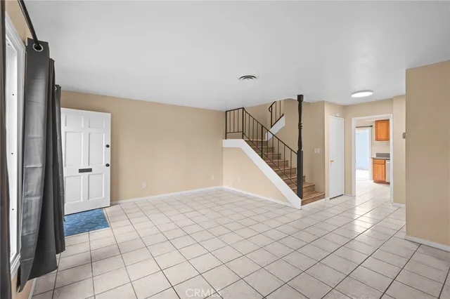 a view of a hallway view with staircase