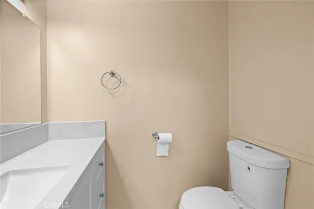 a bathroom with a sink toilet and vanity