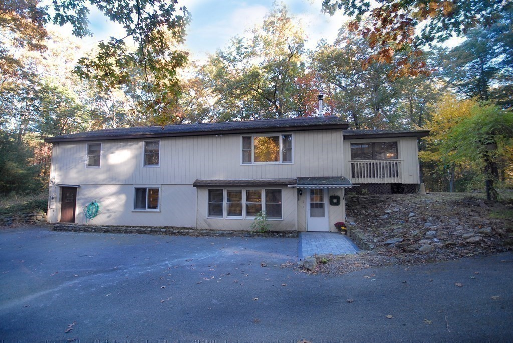 38 Blanchard Road Harvard, MA 01451 - Photo 1 of 26 a front view of a house with a garden