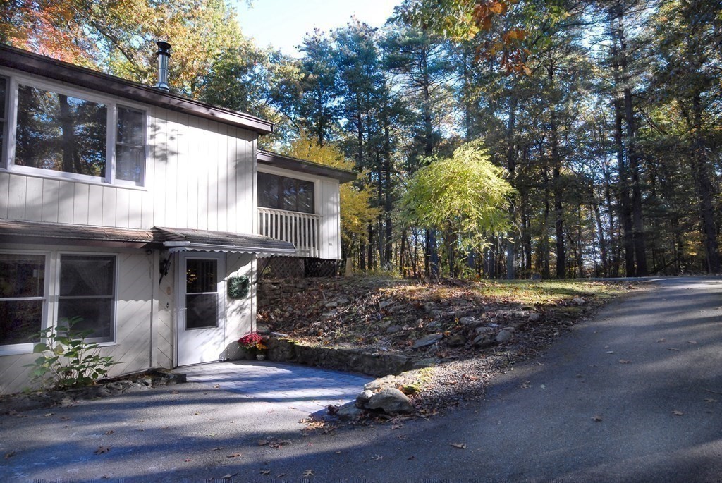 38 Blanchard Road Harvard, MA 01451 - Photo 2 of 26 a view of a house with a tree next to a yard