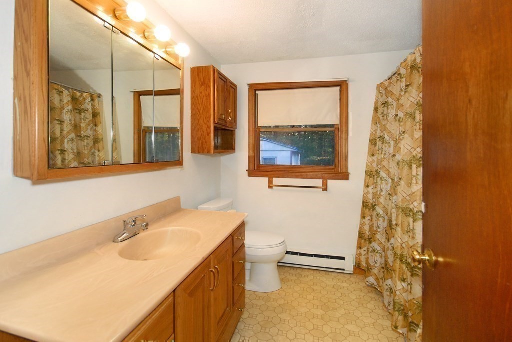 38 Blanchard Road Harvard, MA 01451 - Photo 24 of 26 a bathroom with a sink toilet and shower