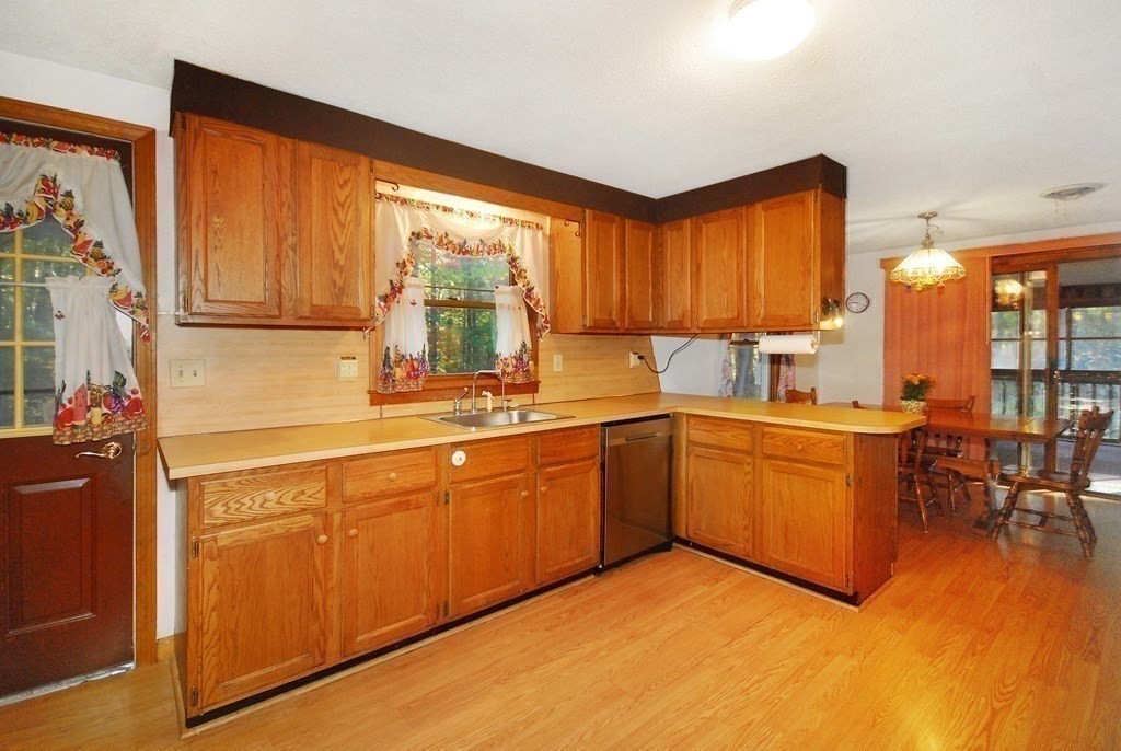38 Blanchard Road Harvard, MA 01451 - Photo 7 of 26 a kitchen with cabinets a sink and appliances