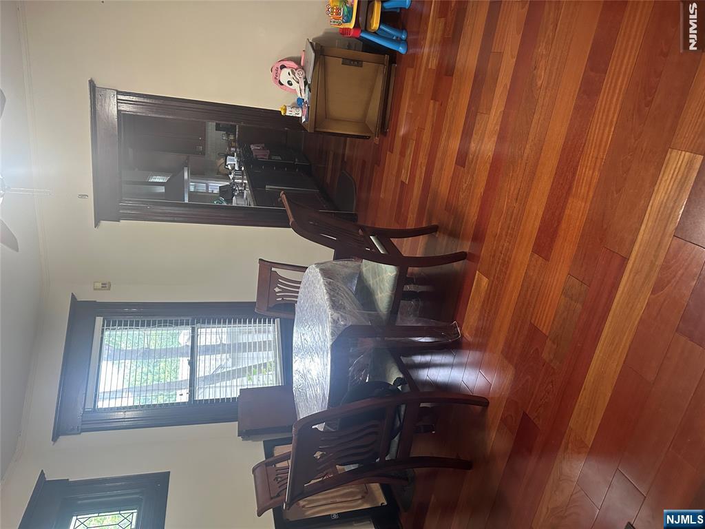 23 Highland Cross, Unit 1 Rutherford, NJ 07070 - Photo 5 of 11 a view of a dining room with furniture and wooden floor