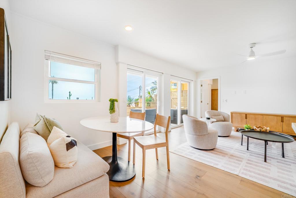 231 5th Street Encinitas, CA 92024 - Photo 35 of 57 a dining room with furniture and wooden floor