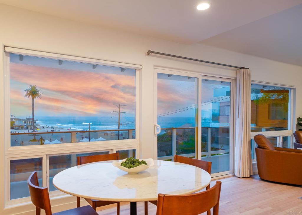 231 5th Street Encinitas, CA 92024 - Photo 5 of 57 a view of a dining room with furniture window and wooden floor