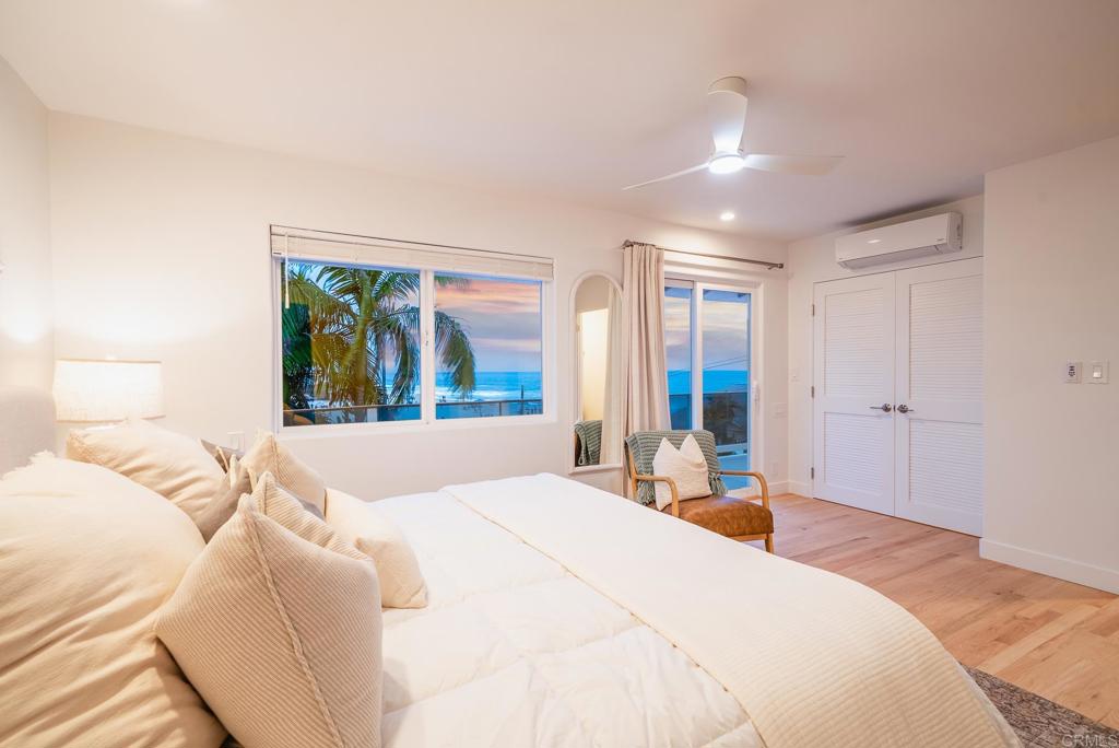 231 5th Street Encinitas, CA 92024 - Photo 9 of 57 a bedroom with a large bed and a window