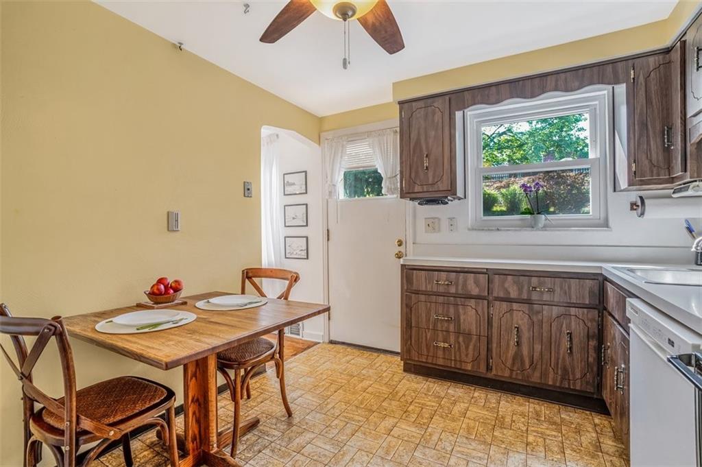 263 Mohawk Drive McKeesport, PA 15135 - Photo 8 of 45 a kitchen with a table chairs and a window