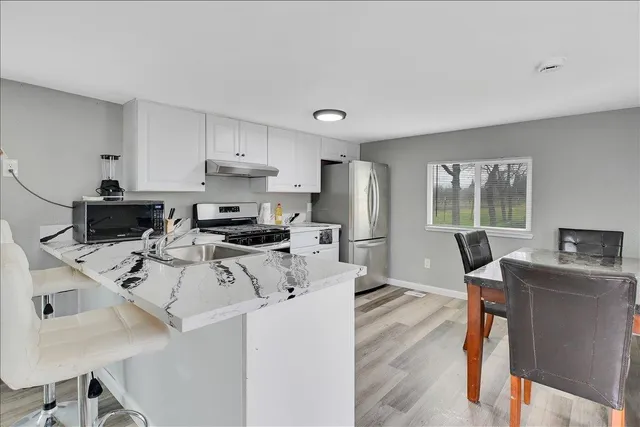 a bed room with a bed and a dresser