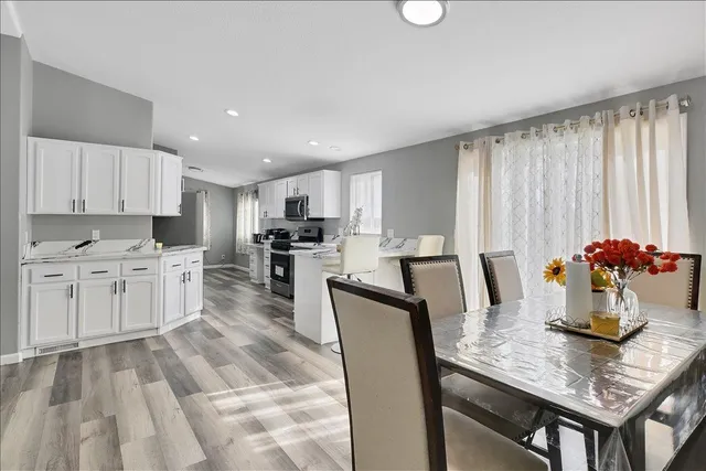 an aerial view of a house with garden space and outdoor seating