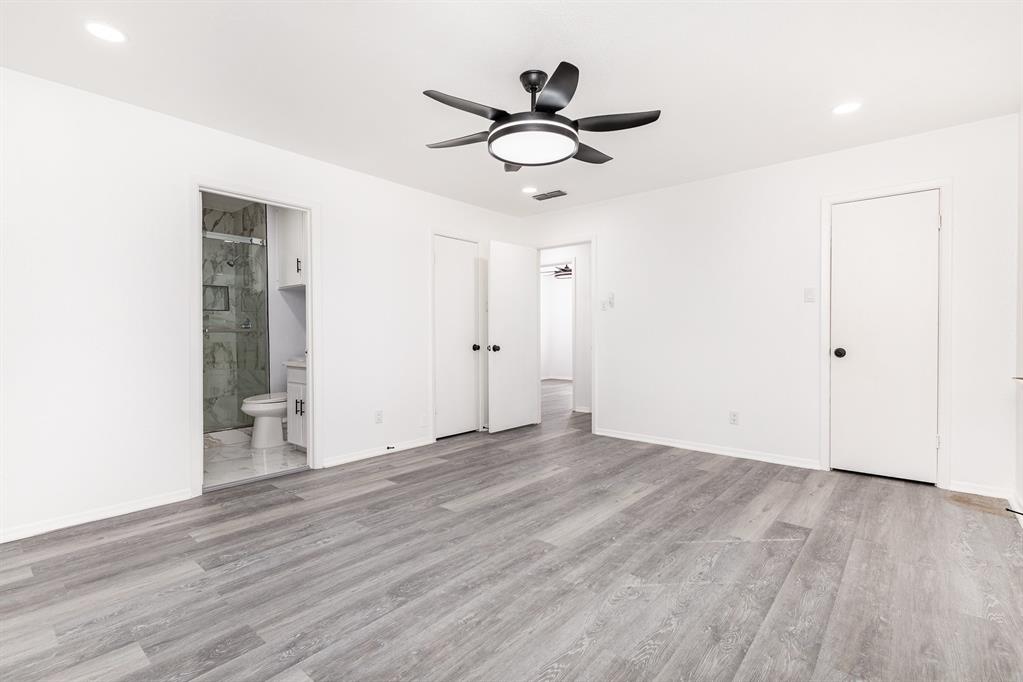 800 Overhill Court Hurst, TX 76053 - Photo 14 of 26 a view of empty room with wooden floor and ceiling fan
