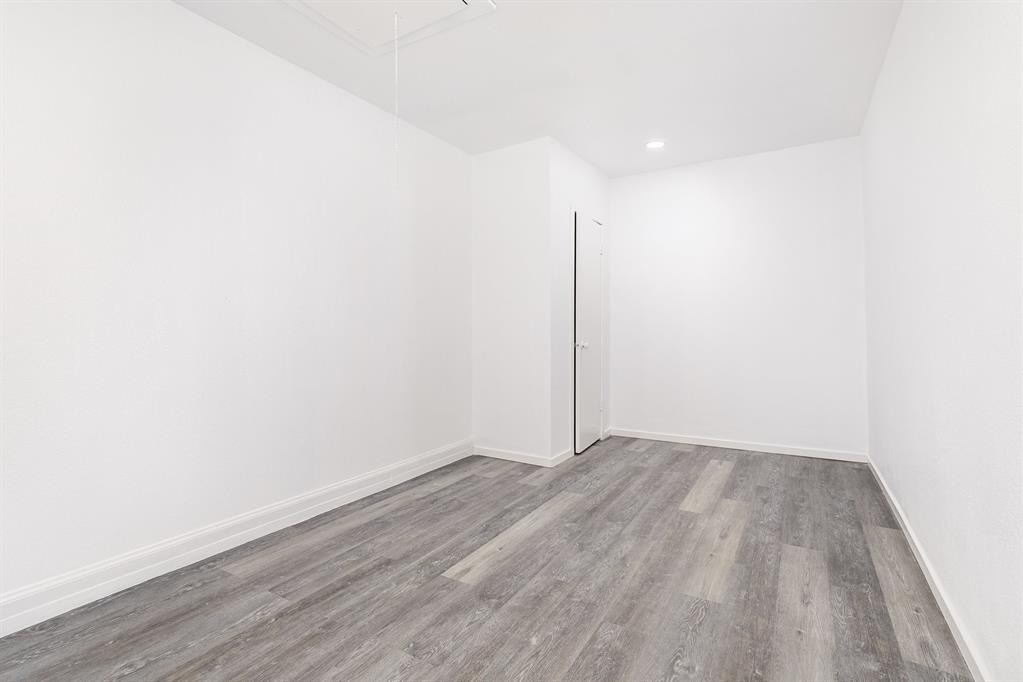 800 Overhill Court Hurst, TX 76053 - Photo 20 of 26 a view of an empty room with wooden floor
