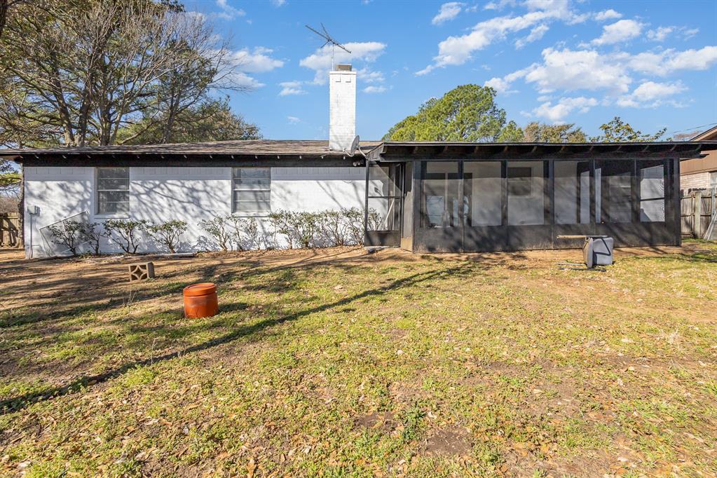 800 Overhill Court Hurst, TX 76053 - Photo 23 of 26 a view of a house with a yard