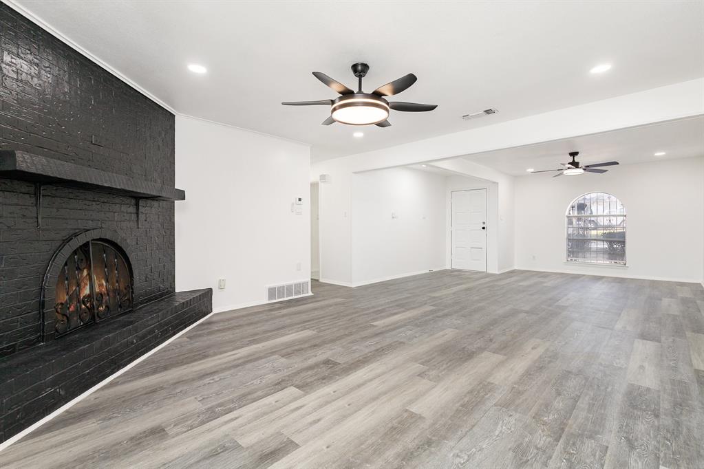 800 Overhill Court Hurst, TX 76053 - Photo 7 of 26 a view of a livingroom with a ceiling fan window and a ceiling fan