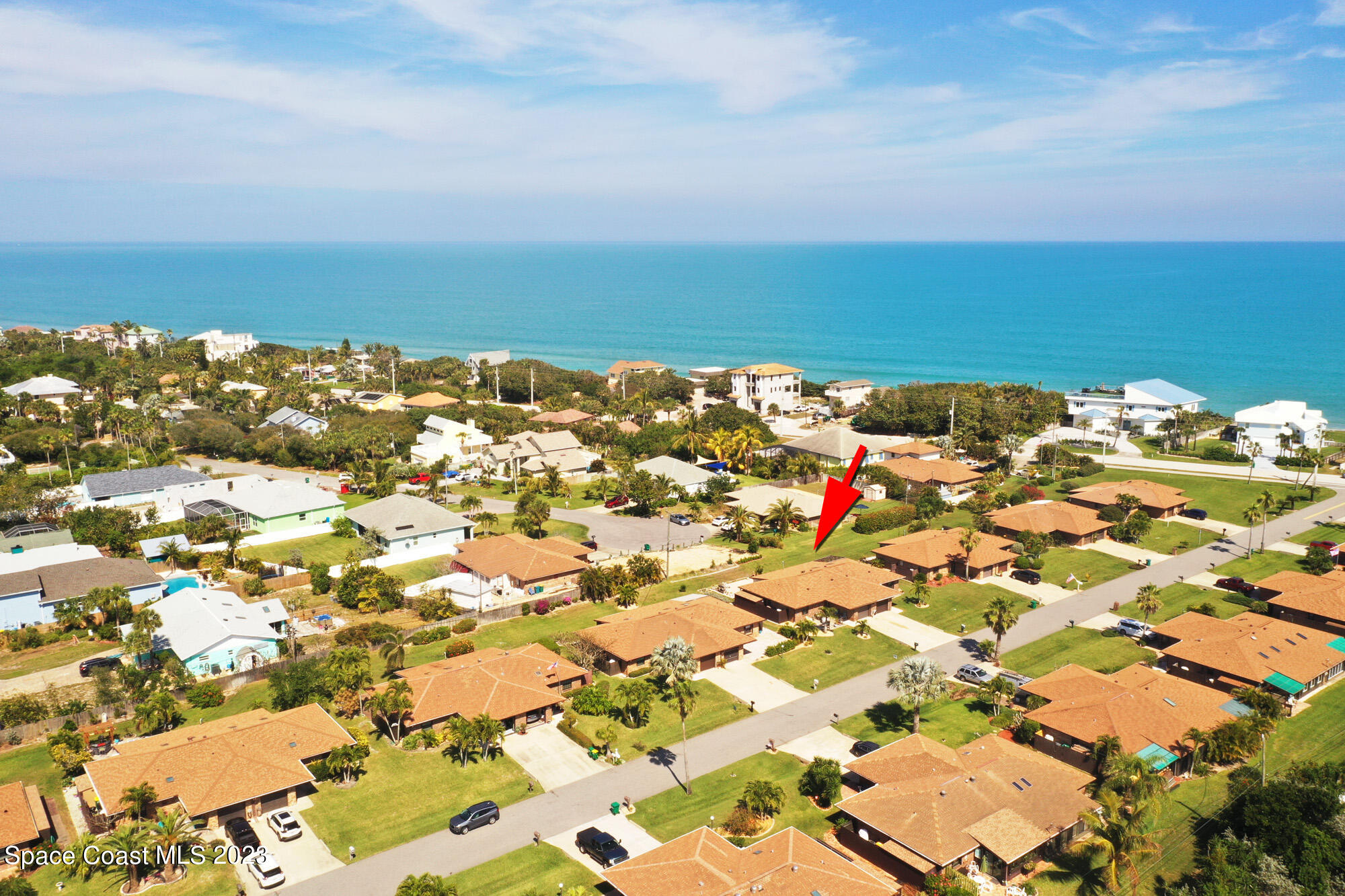116 Normandy Place Melbourne Beach, FL 32951 - Photo 1 of 24 an aerial view of residential building and ocean