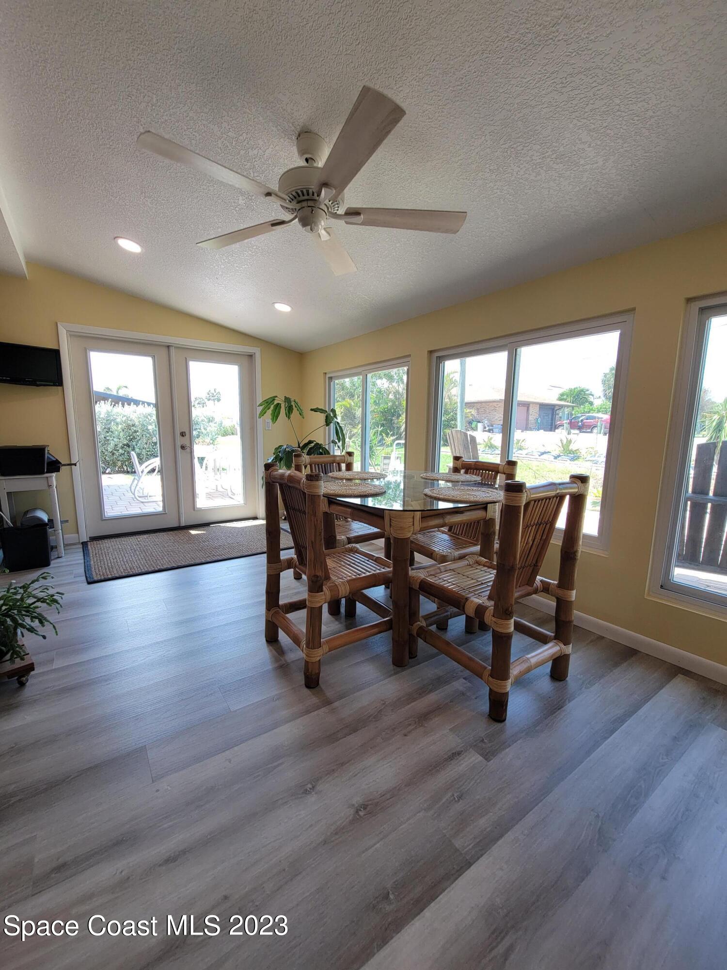 116 Normandy Place Melbourne Beach, FL 32951 - Photo 11 of 24 a workspace with wooden floor and a window