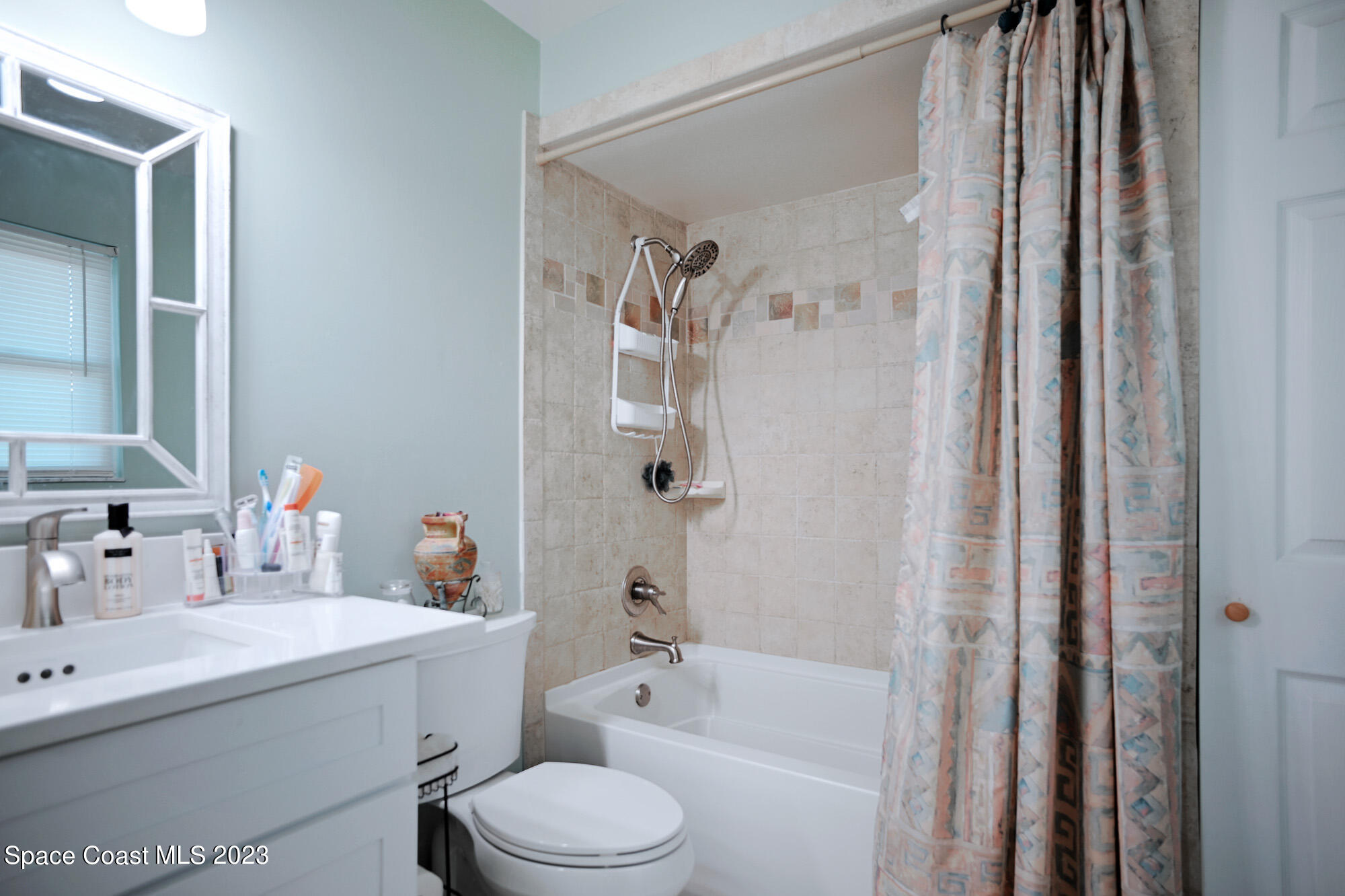 116 Normandy Place Melbourne Beach, FL 32951 - Photo 15 of 24 a bathroom with a sink a toilet and shower