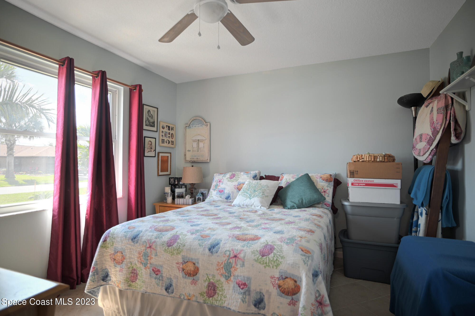 116 Normandy Place Melbourne Beach, FL 32951 - Photo 16 of 24 a bedroom with a bed and a closet