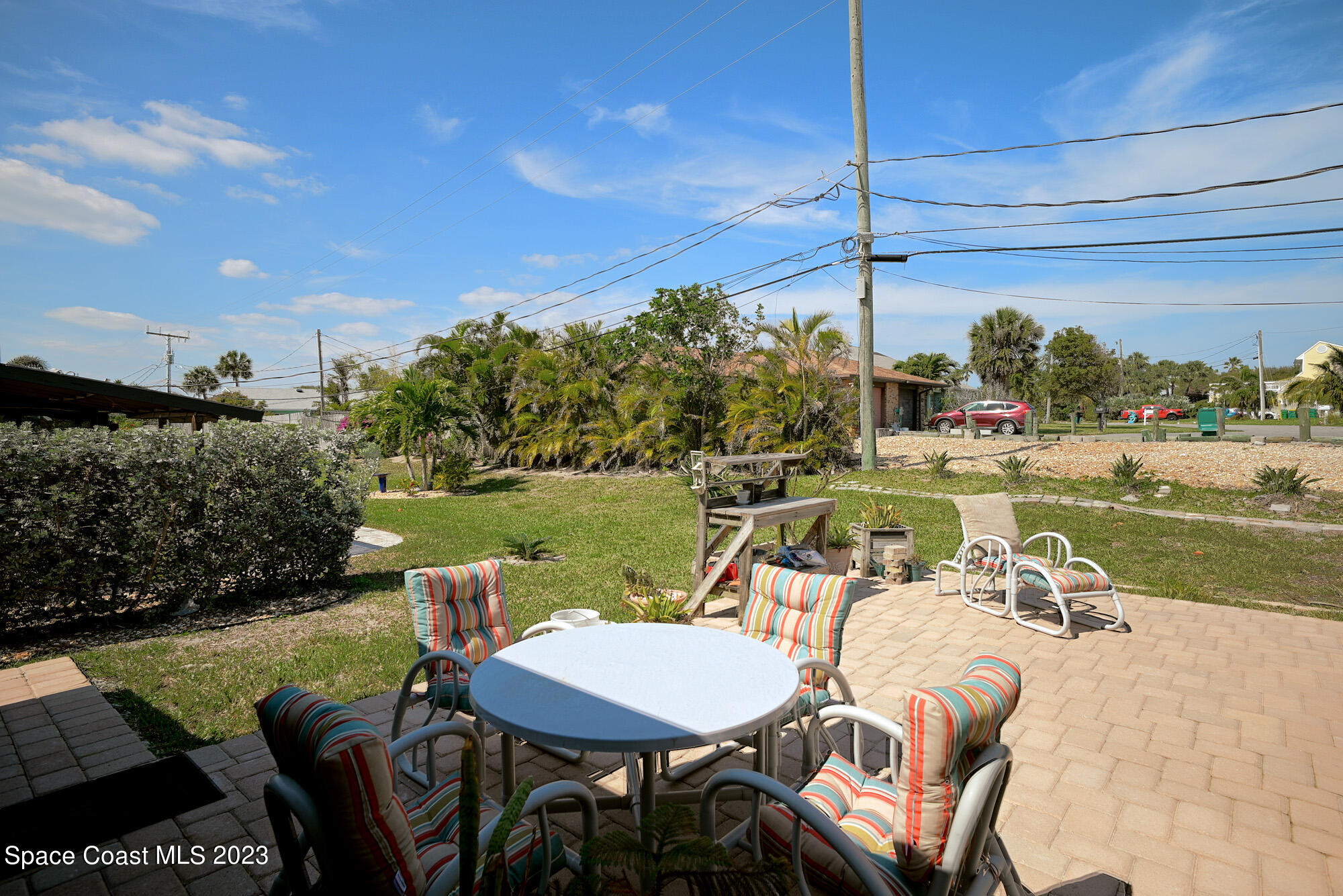 116 Normandy Place Melbourne Beach, FL 32951 - Photo 18 of 24 a view of a chairs and table in patio