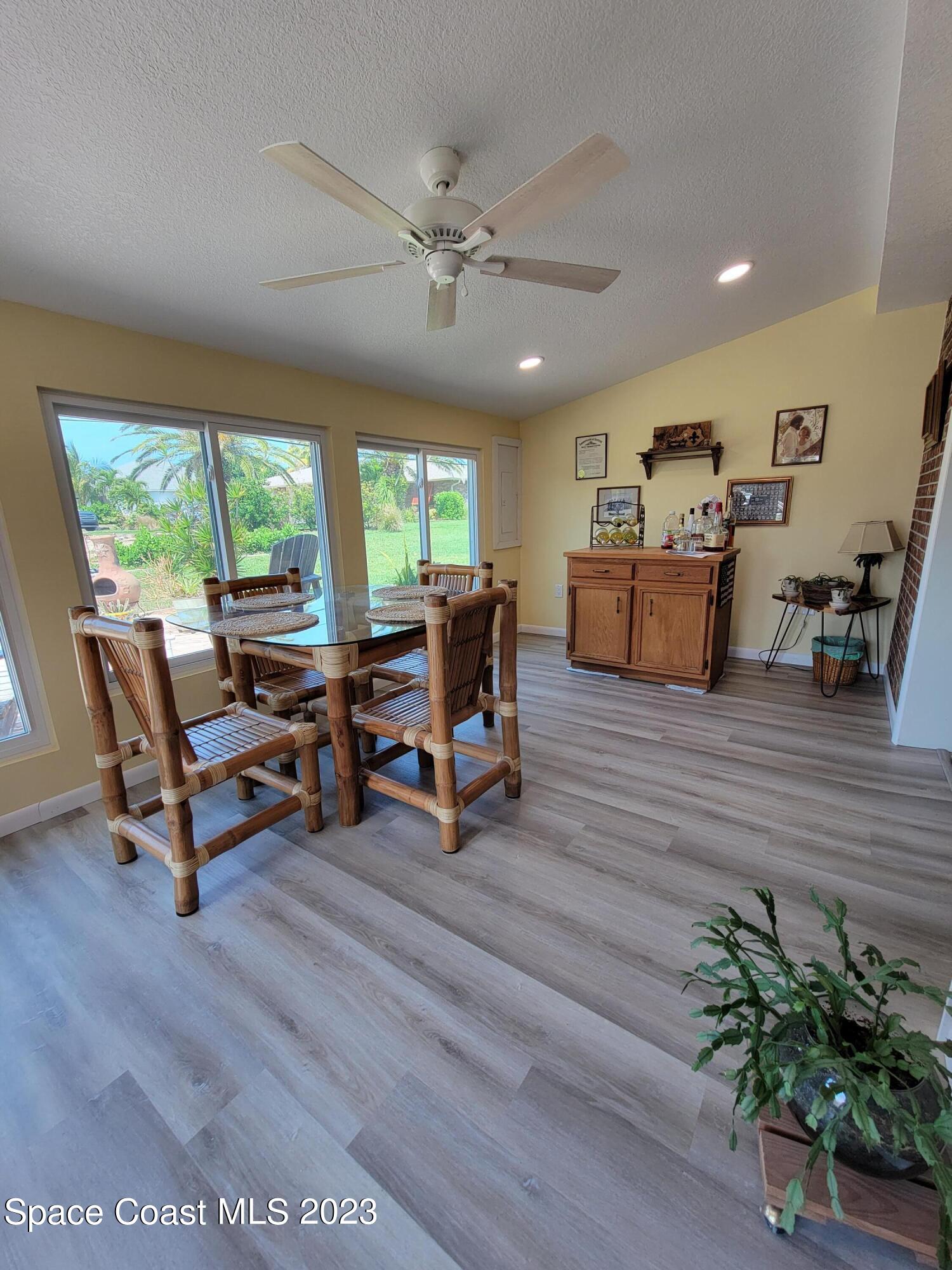 116 Normandy Place Melbourne Beach, FL 32951 - Photo 10 of 24 a living room with furniture and a potted plant