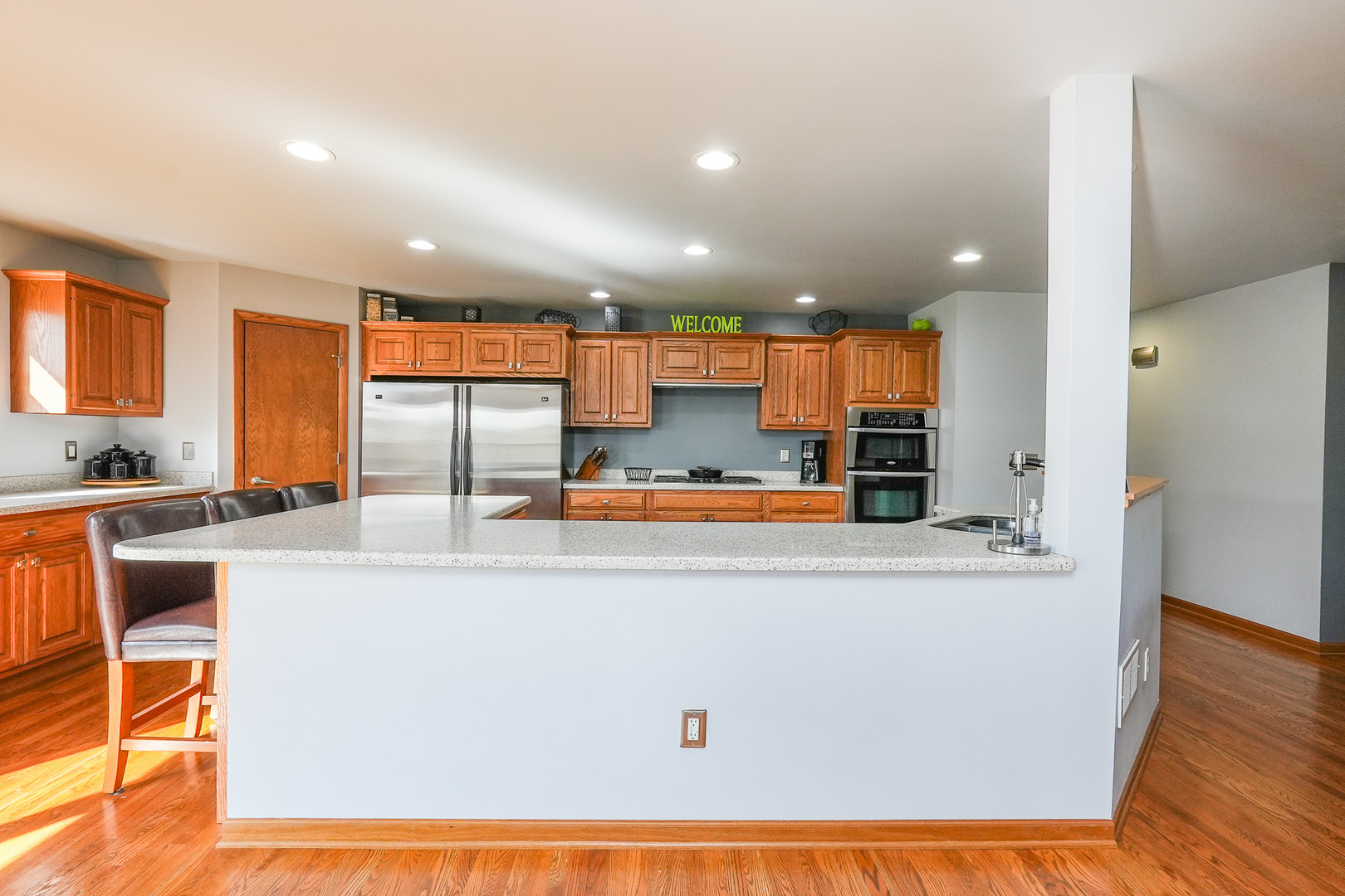 1135 Eagle Circle Bourbonnais, IL 60914 - Photo 13 of 36 a large kitchen with stainless steel appliances and a refrigerator