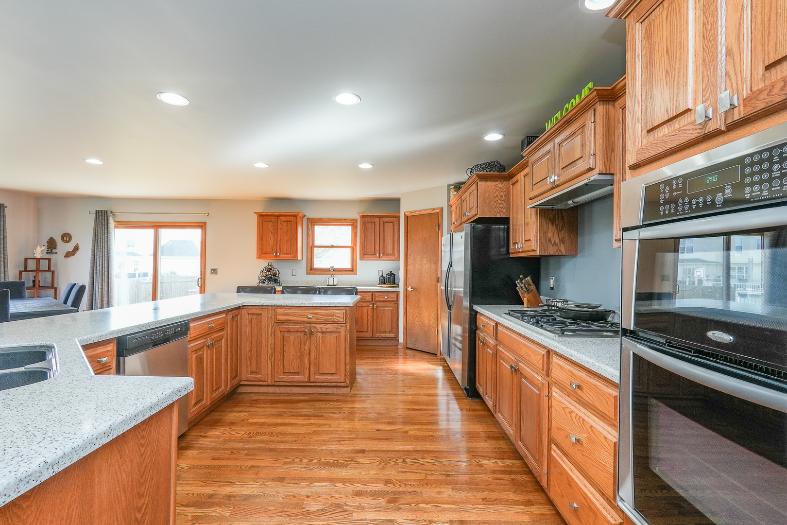 1135 Eagle Circle Bourbonnais, IL 60914 - Photo 16 of 36 a large kitchen with stainless steel appliances granite countertop a lot of counter space and a sink