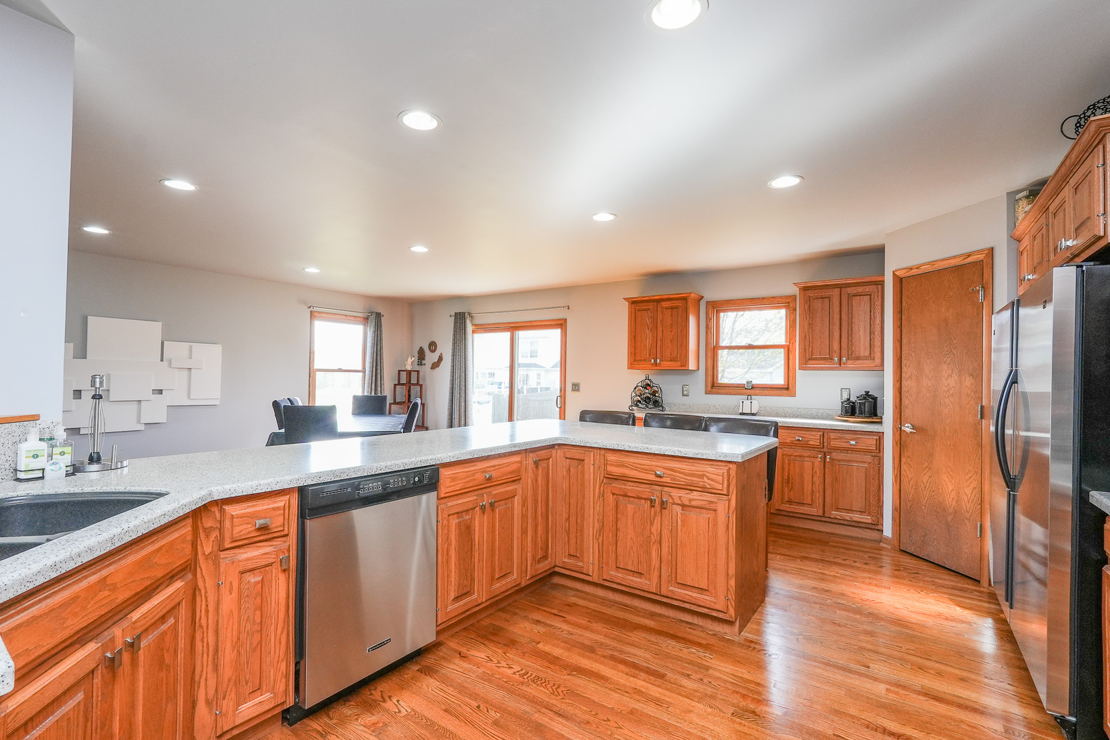 1135 Eagle Circle Bourbonnais, IL 60914 - Photo 17 of 36 a large kitchen with granite countertop lots of counter top space and refrigerator