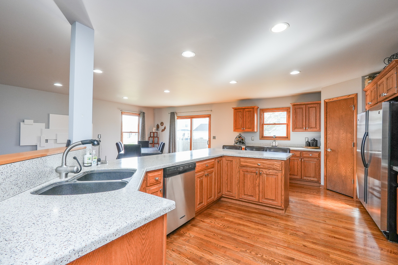 1135 Eagle Circle Bourbonnais, IL 60914 - Photo 20 of 36 a kitchen with stainless steel appliances granite countertop a sink stove and refrigerator