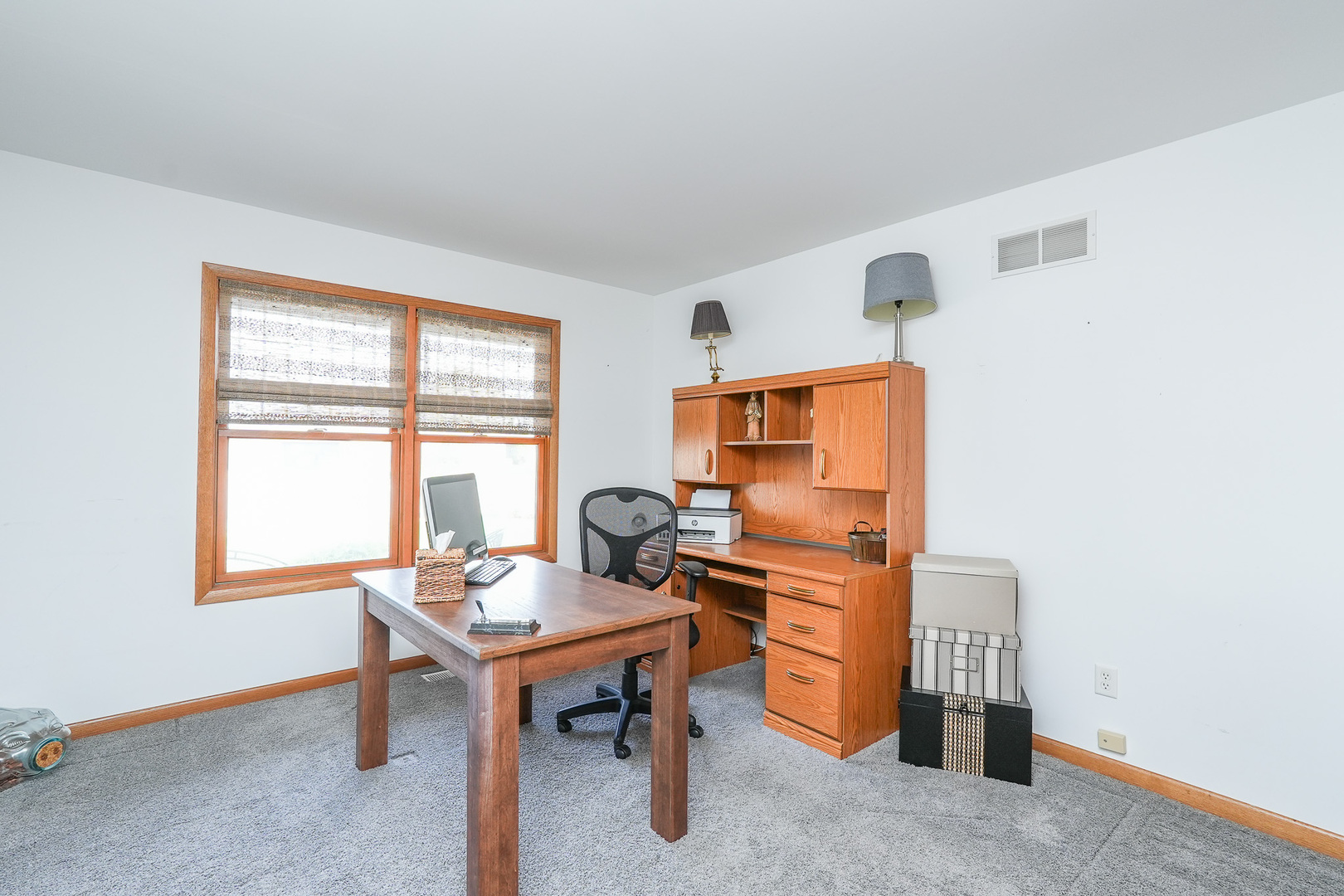 1135 Eagle Circle Bourbonnais, IL 60914 - Photo 25 of 36 a view of a workspace with furniture and a window