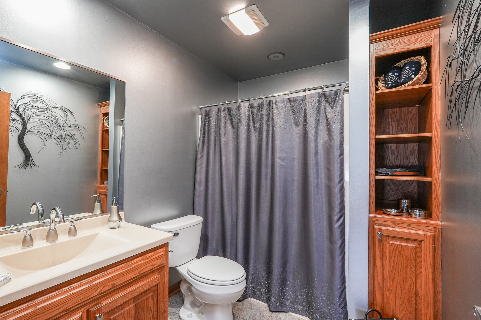 1135 Eagle Circle Bourbonnais, IL 60914 - Photo 27 of 36 a bathroom with a sink a toilet and shower curtain