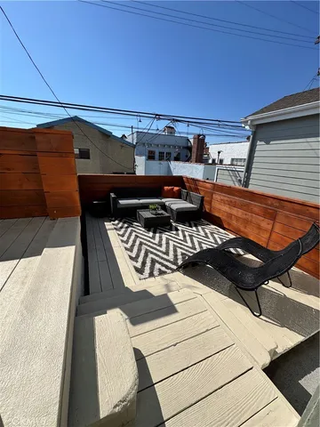 a view of a livingroom with furniture and a flat screen tv