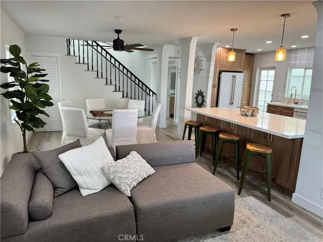 a living room with furniture or couch and a potted plant