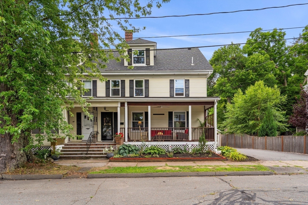 15 Beacon Street Danvers, MA 01923 - Photo 1 of 42 a front view of a house with a yard and potted plants