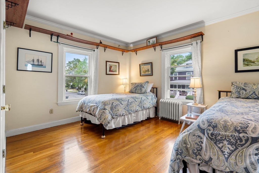 15 Beacon Street Danvers, MA 01923 - Photo 15 of 42 a bedroom with a bed painting on wall and a large window