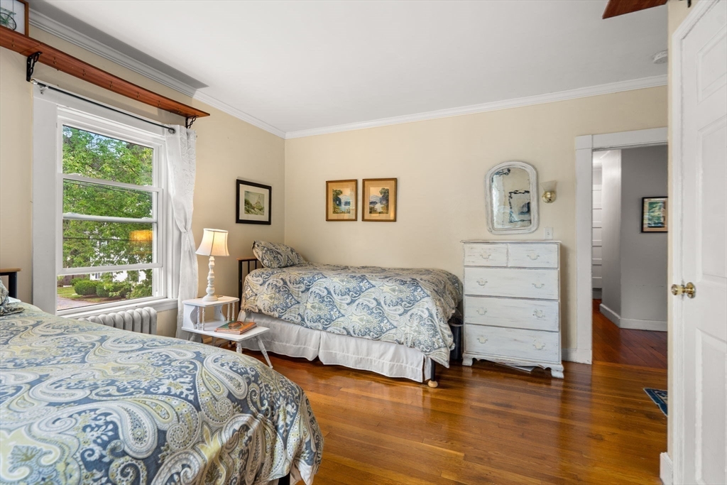 15 Beacon Street Danvers, MA 01923 - Photo 16 of 42 a bedroom with a bed and a large window