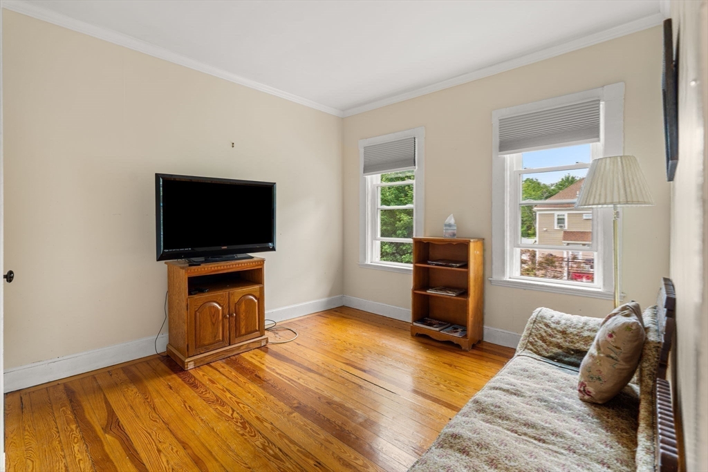 15 Beacon Street Danvers, MA 01923 - Photo 19 of 42 a living room with furniture and a flat screen tv