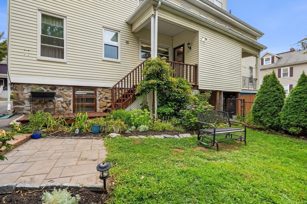 15 Beacon Street Danvers, MA 01923 - Photo 35 of 42 a front view of a house with a yard and outdoor seating