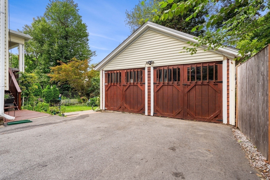 15 Beacon Street Danvers, MA 01923 - Photo 36 of 42 a view of a small house with wooden fence