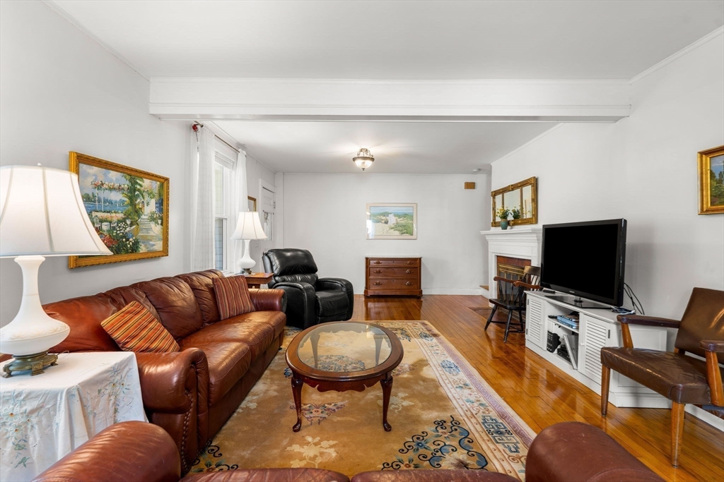 15 Beacon Street Danvers, MA 01923 - Photo 4 of 42 a living room with furniture and a flat screen tv