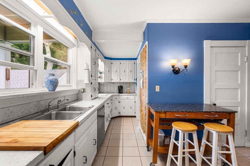 15 Beacon Street Danvers, MA 01923 - Photo 10 of 42 a bathroom with a granite countertop sink and a mirror