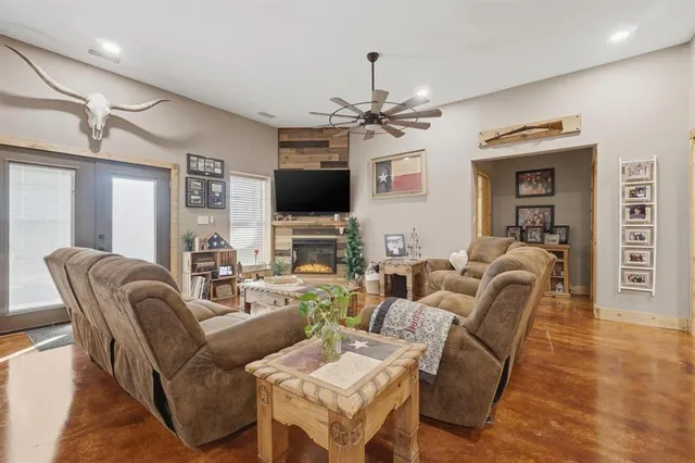 a living room with furniture and a flat screen tv